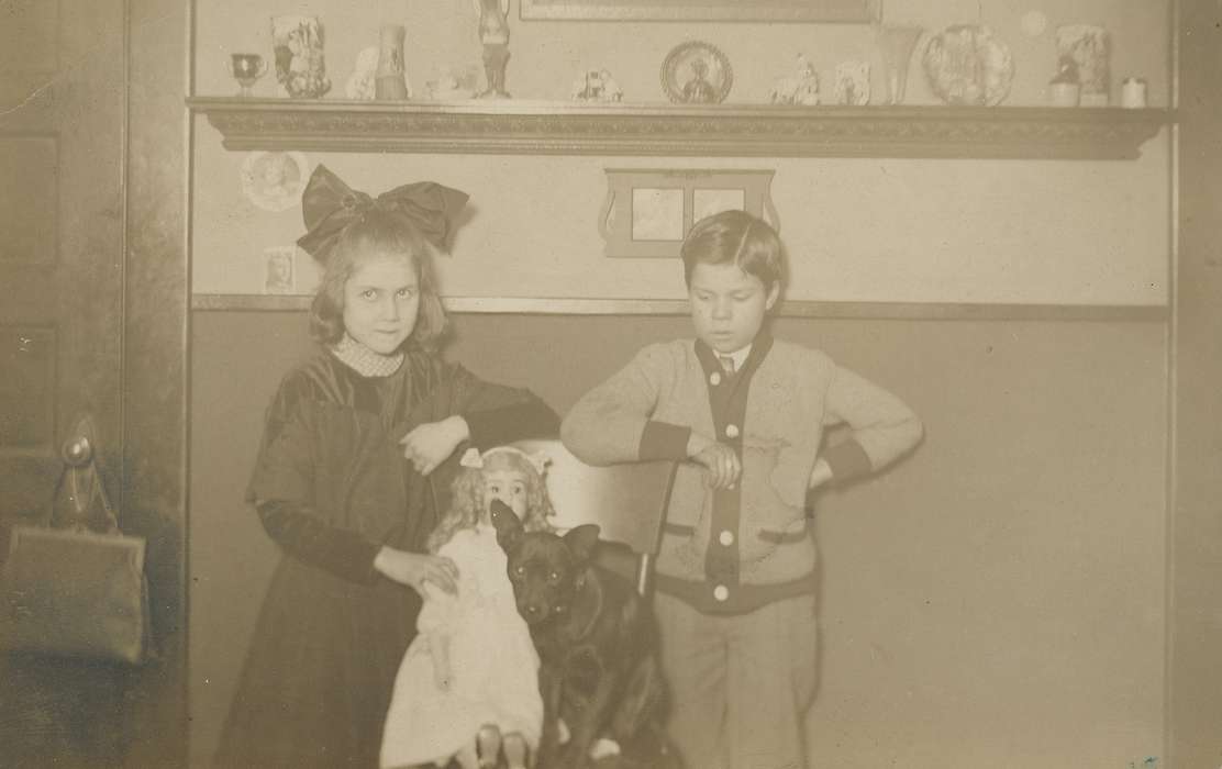 girl, Portraits - Group, purse, Black Hawk, Iowa, Children, history, Animals, Families, O'Brink, Lisa, Waterloo, hair bow, dress, doll, paneling, ia, puppy, bow, historic, United States, Photos, cardigan, shelf, boy, dog, IA