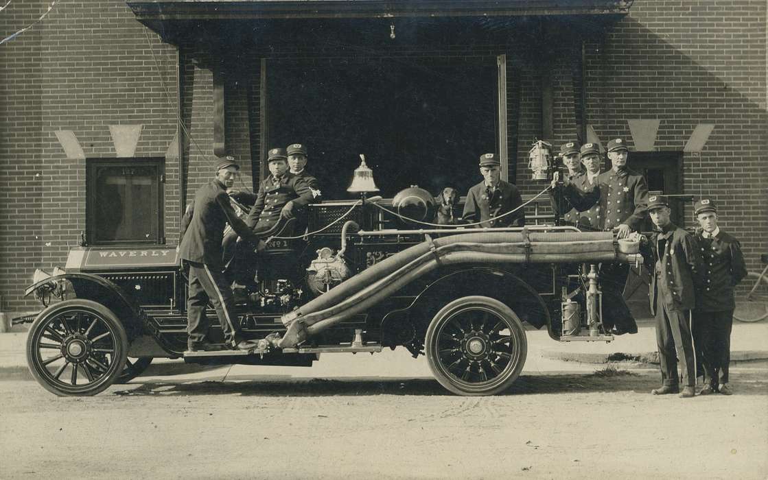 Iowa History, Portraits - Group, porter cap, tire, wheel, firemen, wheels, Meyer, Mary, tires, uniform, car, Motorized Vehicles, brick, bell, Iowa, history of Iowa, fire truck, Labor and Occupations, Cities and Towns