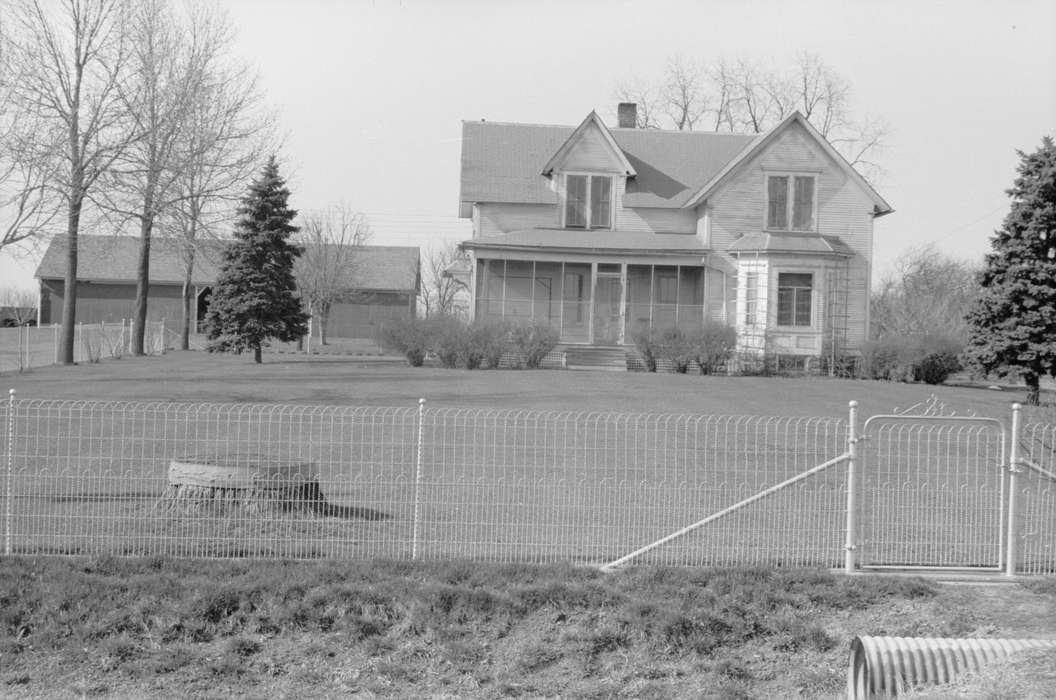 pine trees, history of Iowa, Farms, front yard, Iowa, Landscapes, bushes, farmhouse, Barns, tree, Library of Congress, culvert, front porch, yard fence, Iowa History