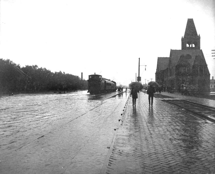 Floods, brick street, Lemberger, LeAnn, Iowa History, train, train track, Iowa, Ottumwa, IA, history of Iowa, umbrella