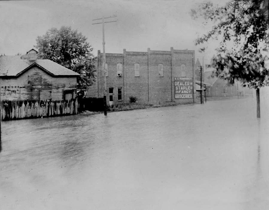 Businesses and Factories, history of Iowa, Lemberger, LeAnn, fence, sign, Floods, Iowa, Iowa History, street, building, Ottumwa, IA
