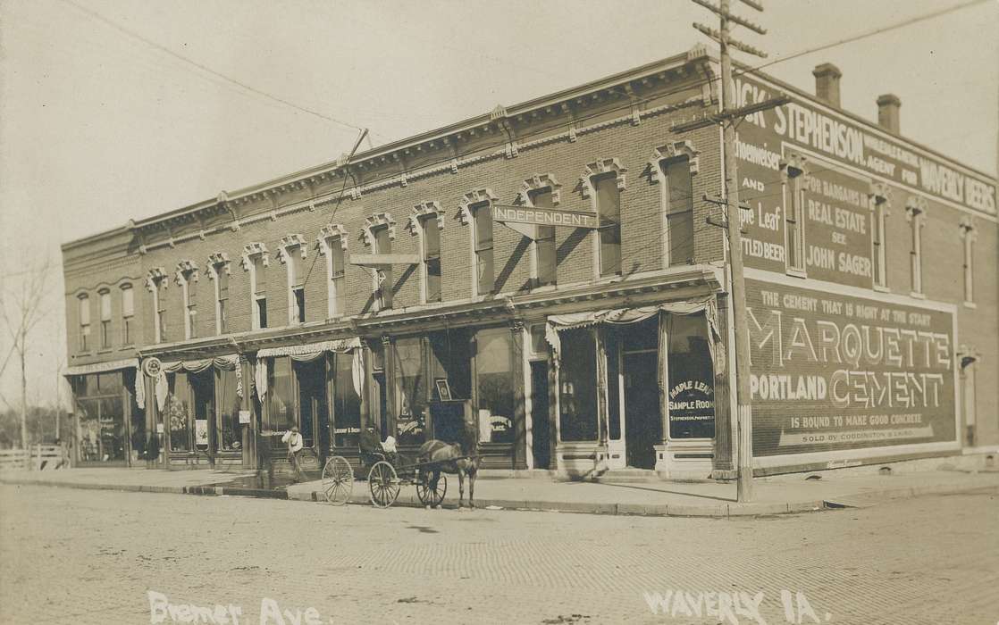 Waverly, IA, Businesses and Factories, Animals, horse and buggy, brick building, correct date needed, history of Iowa, Main Streets & Town Squares, telephone pole, awning, Iowa History, Iowa, window display, Waverly Public Library, e. bremer ave.