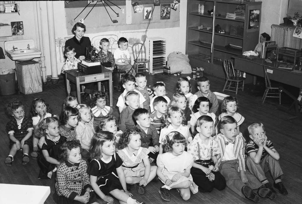 girl, ia, teacher, student, Photos, historic, Schools and Education, Iowa, history, wooden desk, Portraits - Group, bookshelf, Coon Rapids Enterprise, United States, IA, wooden chair, Coon Rapids, classroom, boy, woman, Children