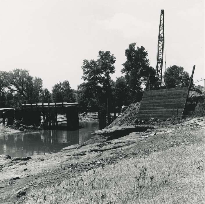 tree, construction crew, construction, bridge, river, Waverly, IA, cedar river, construction materials, history of Iowa, Labor and Occupations, summer, wood panel, crane, Waverly Public Library, Floods, Iowa History, Lakes, Rivers, and Streams, Iowa, hard hat, Motorized Vehicles, people