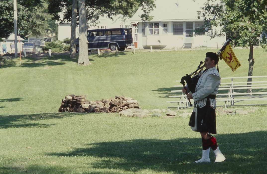 bagpipe, van, Leisure, Iowa, trees, fire wood, firewood, grass, Motorized Vehicles, Homes, music, Iowa History, history of Iowa, Western Home Communities, Cities and Towns, flag