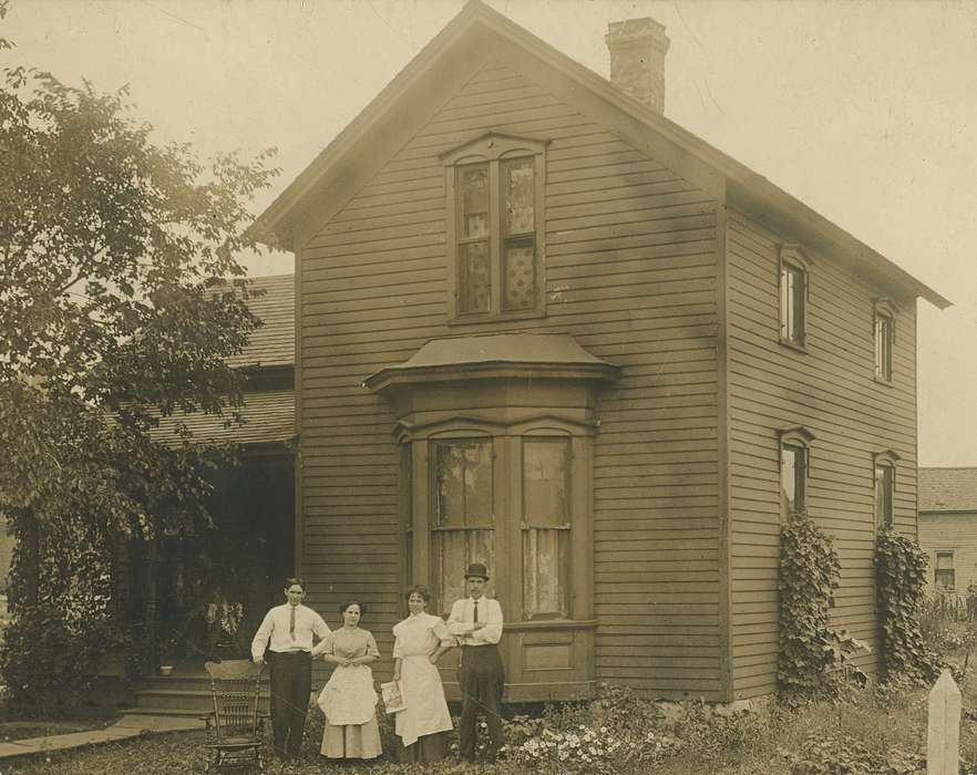 Portraits - Group, Black Hawk, house, women, Iowa, history, Families, O'Brink, Lisa, Waterloo, men, porch, flowers, bay window, ia, ivy, top hat, historic, United States, Photos, Homes, IA, suit, apron