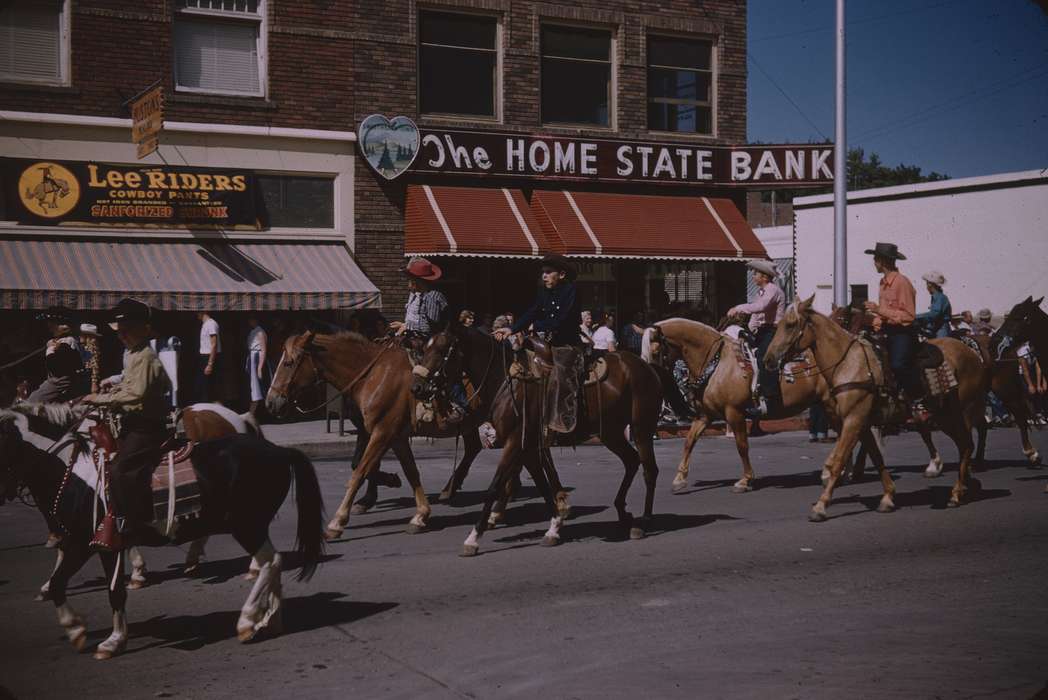 history of Iowa, Fairs and Festivals, cowboy hat, store front, Animals, Sack, Renata, bank, cowboy, USA, Iowa History, parade, Iowa, advertisement, horse, Main Streets & Town Squares, Entertainment, horse racing