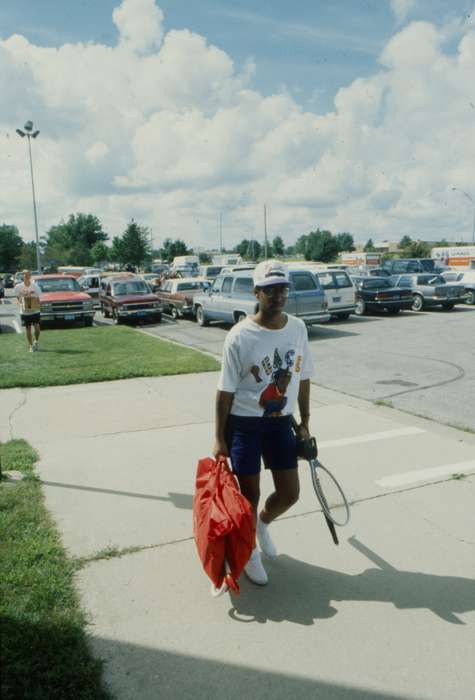 tennis racket, People of Color, Cedar Falls, IA, history of Iowa, uni, luggage, car, parking lot, university of northern iowa, Iowa, Iowa History, Motorized Vehicles, Schools and Education, van, UNI Special Collections & University Archives