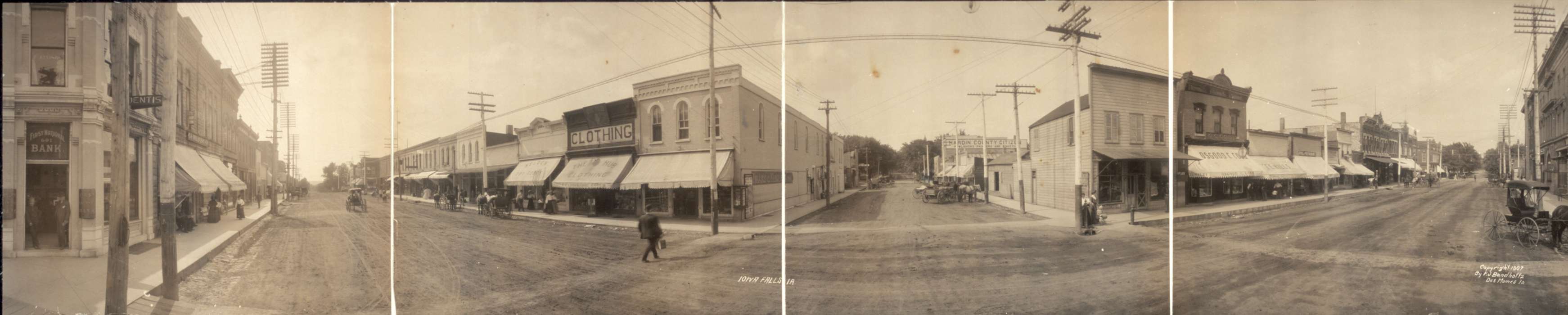 sidewalk, Cities and Towns, Children, electrical pole, horse and buggy, Families, Leisure, horse, Portraits - Group, Iowa, first national bank, Businesses and Factories, clothing store, panorama, pedestrian, Iowa History, Main Streets & Town Squares, history of Iowa, horse drawn wagon, intersection, power lines, Library of Congress, Animals, dirt street