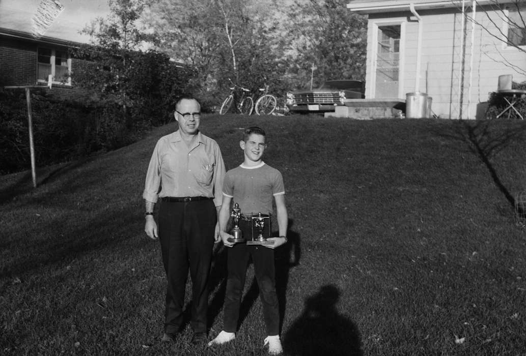 photographer's shadow, ia, Iowa, history, Portraits - Individual, IA, United States, Sports, father and son, Coon Rapids, Photos, Coon Rapids Enterprise, Families, trophy, historic, portrait duo
