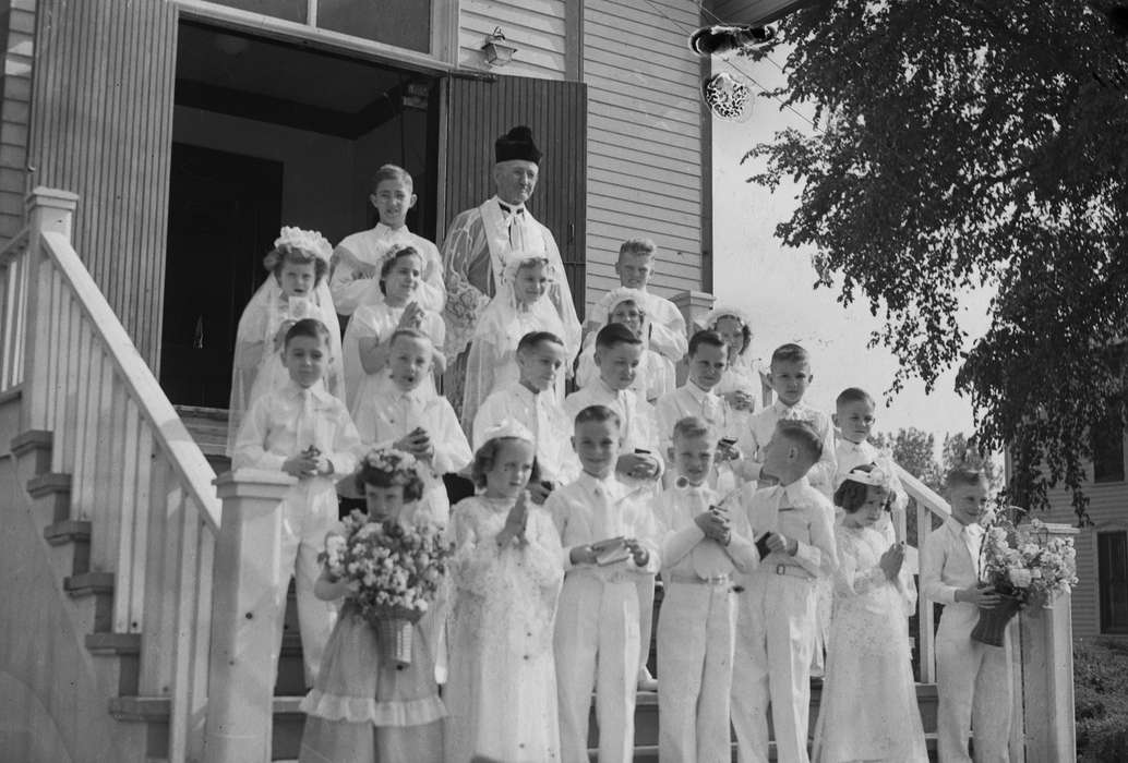 Portraits - Group, priest, history, Photos, flowers, Children, Religion, Iowa, IA, catholic church, Civic Engagement, formal attire, Religious Structures, United States, ia, Coon Rapids Enterprise, historic, children, Coon Rapids