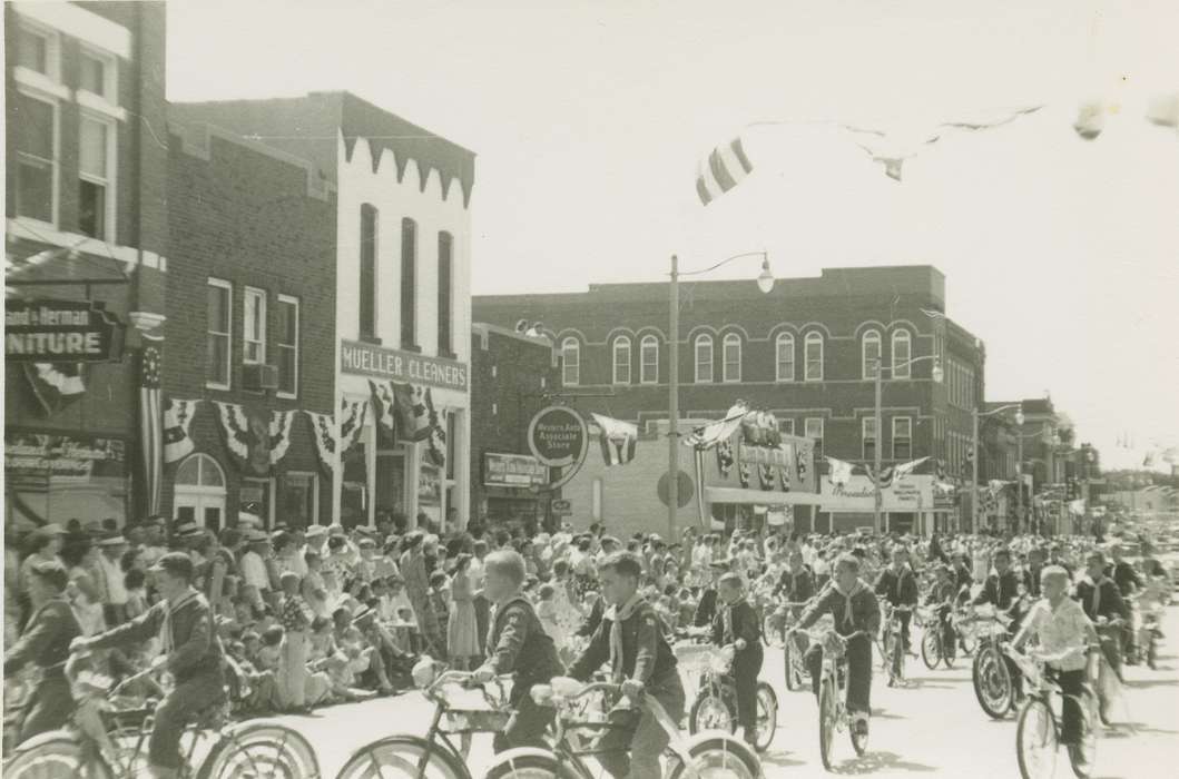 bike, brick building, boy scout, bicycle, crowd, flag, boy, parade, banner, Entertainment, Meyer, Mary, Children, Main Streets & Town Squares, Cities and Towns, Businesses and Factories