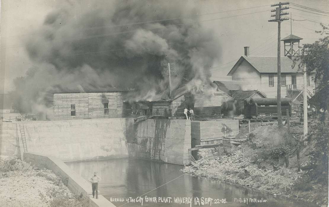 Iowa, fire, firefighters, Businesses and Factories, Wrecks, building, Meyer, Mary, history of Iowa, dam, burning, power lines, power plant, stone wall, Iowa History, water, smoke, Cities and Towns