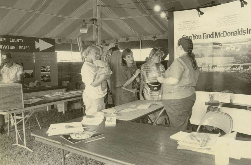 display, county fair, Waverly, IA, Iowa, Waverly Public Library, posters, Portraits - Group, Animals, tent, girl, chair, correct date needed, Iowa History, history of Iowa, fanny pack, Fairs and Festivals, table, Children