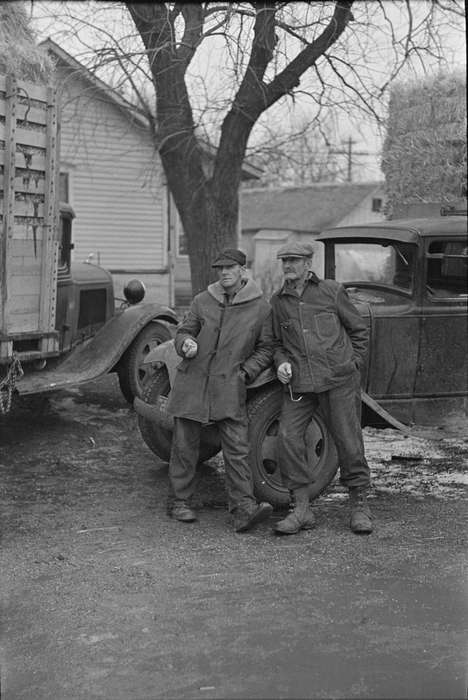work clothes, melting snow, hay truck, tree, farmers, Portraits - Group, Farming Equipment, snow, history of Iowa, Cities and Towns, Iowa History, Library of Congress, Motorized Vehicles, square bales, Labor and Occupations, Iowa
