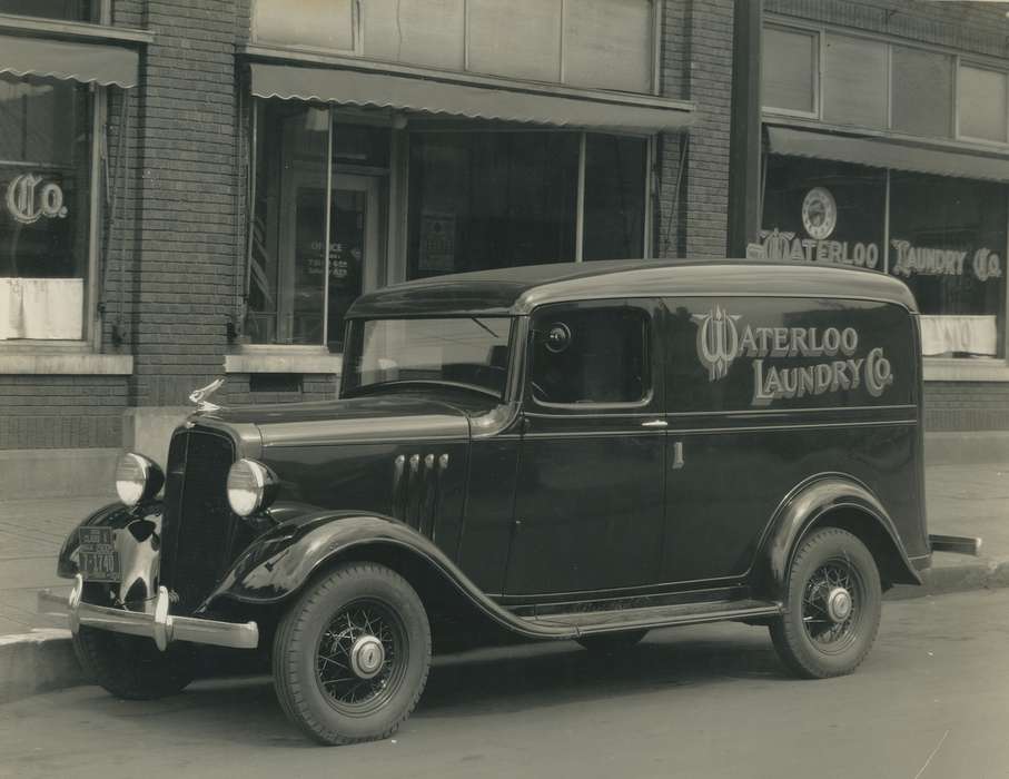 Motorized Vehicles, Iowa, Businesses and Factories, wheels, O'Brink, Lisa, wheel, headlights, car, tire, Labor and Occupations, Iowa History, headlight, tires, Main Streets & Town Squares, history of Iowa, storefront, windshield