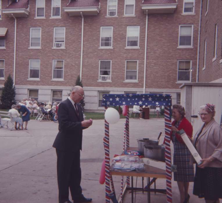 tie, dress, brick building, Entertainment, bench, Iowa History, independence day, suit, balloons, Western Home Communities, fourth of july, Iowa, Businesses and Factories, pot, history of Iowa