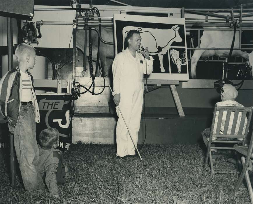 cow, Children, Photos, historic, wooden chair, Grout Museum of History and Science, United States, boy, Iowa, demonstration, Portraits - Individual, coveralls, Black Hawk, poster, Fairs and Festivals, ia, cattle congress, national cattle congress, history, presentation, Waterloo, IA, Animals, man