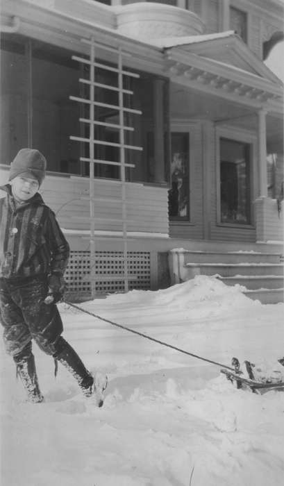 snow, Iowa History, snow day, history of Iowa, Vinton, IA, sled, Mullenix, Angie, homes, snowsuit, Children, yard, boots, Iowa, coat, hat, front porch, Winter, Outdoor Recreation
