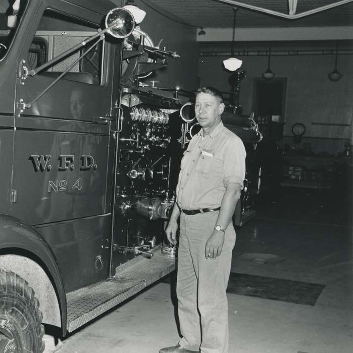 Waverly Public Library, Waverly, IA, fire engine, light, Iowa History, correct date needed, history of Iowa, Labor and Occupations, watch, Businesses and Factories, Motorized Vehicles, man, Iowa, cigarette, fire truck, Portraits - Individual, garage, fire station