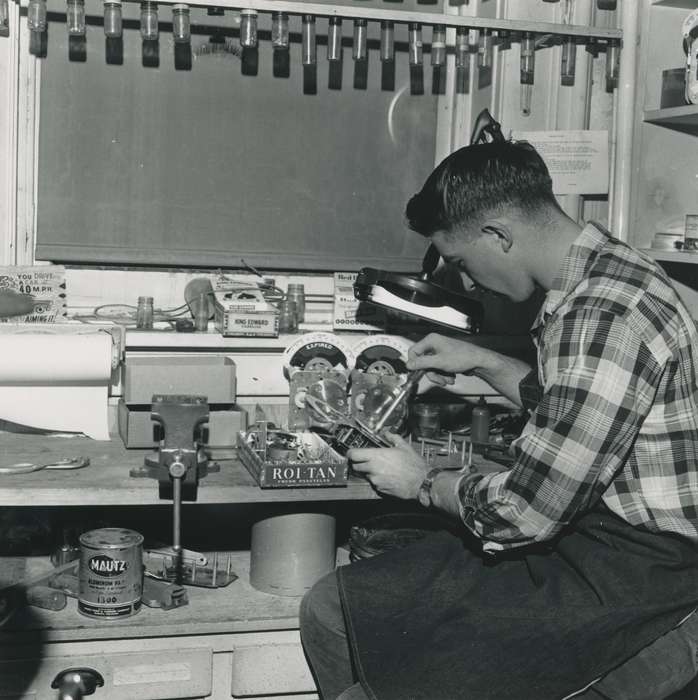 paint can, Labor and Occupations, pliers, Portraits - Individual, Iowa, Iowa History, Waverly, IA, correct date needed, history of Iowa, jar, Waverly Public Library, bench vice, man, plaid shirt, workbench, Children, watch, cigar, apron