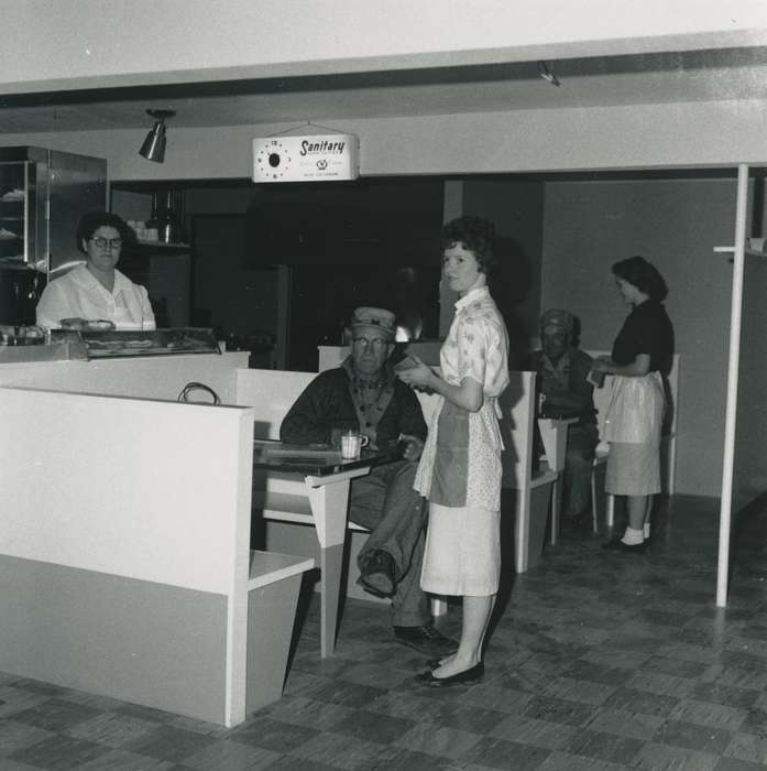 counter, uniform, Labor and Occupations, hat, Iowa, Iowa History, cafe, Waverly, IA, correct date needed, history of Iowa, woman, cup, booth, light, Waverly Public Library, waitress, glasses, clock, Portraits - Group, Businesses and Factories, apron
