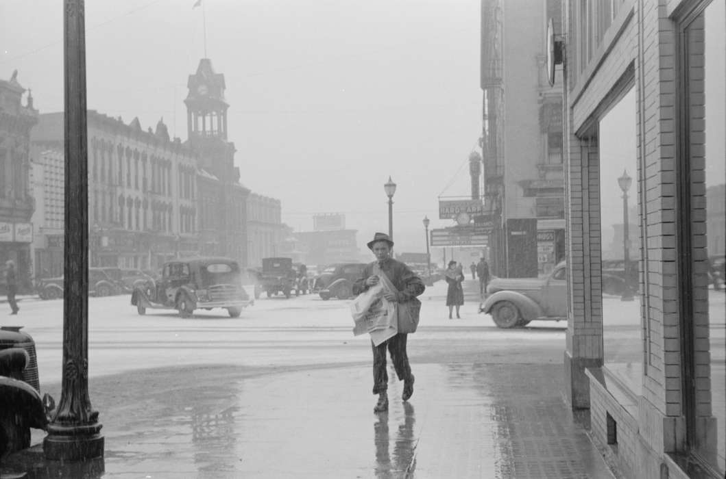 Cities and Towns, Iowa History, paper route, history of Iowa, newsboy, Businesses and Factories, mainstreet, Motorized Vehicles, Main Streets & Town Squares, Library of Congress, storefront, Labor and Occupations, Children, traffic, Iowa, Winter, street corner