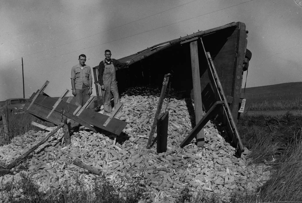 two men, Portraits - Individual, United States, history, ia, bridge collapse, Photos, Coon Rapids Enterprise, corn, historic, Iowa, rural, IA, Coon Rapids, Wrecks, truck flipped