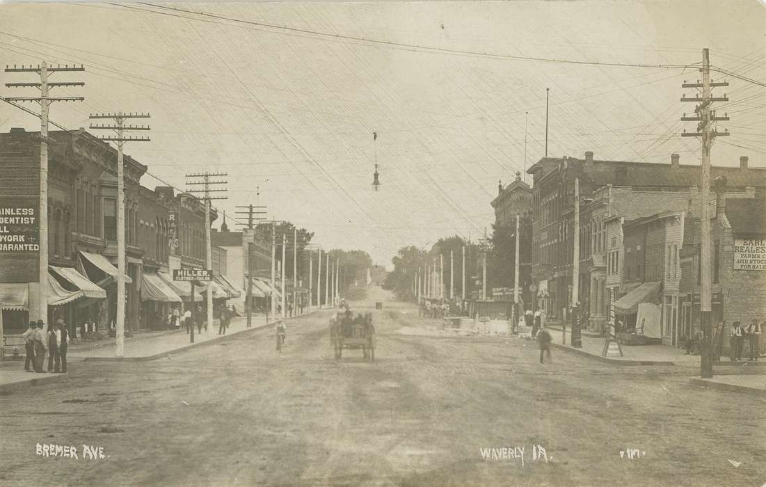 telephone poles, people, brick building, Iowa History, history of Iowa, Waverly Public Library, Main Streets & Town Squares, horse drawn wagon, Waverly, IA, Cities and Towns, clothing store, Iowa, mainstreet, dentist, horse and cart, Businesses and Factories