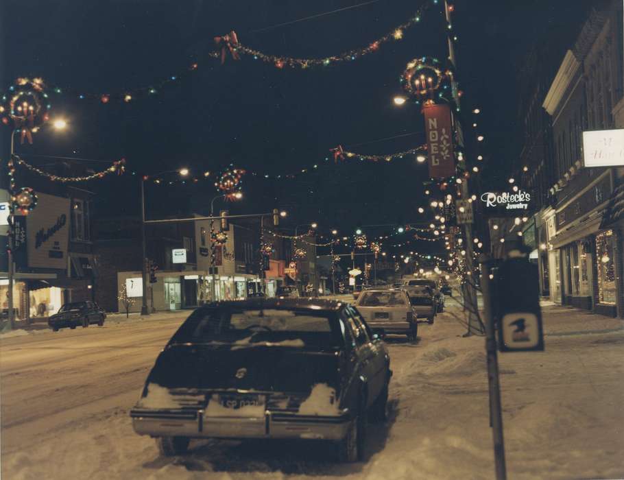 main street, snow, Motorized Vehicles, Main Streets & Town Squares, Iowa, christmas wreath, Iowa History, Holidays, Waverly, IA, Winter, Cities and Towns, jewelry store, christmas lights, Waverly Public Library, cars, Businesses and Factories, history of Iowa