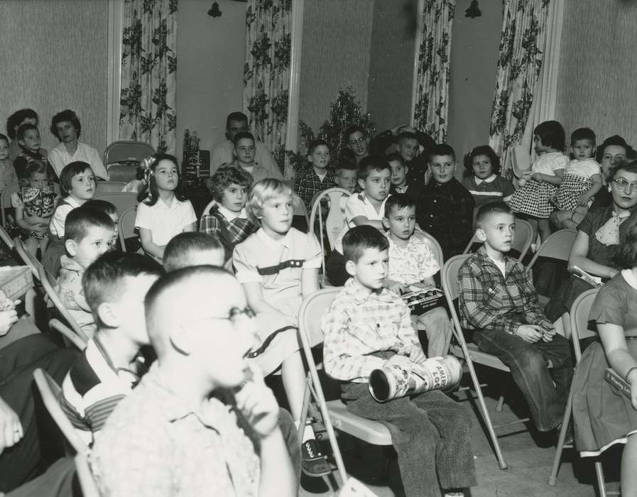 Children, film projector, christmas tree, Holidays, plaid shirt, Iowa History, glasses, Entertainment, Iowa, Waverly Public Library, curtain, movie projector, history of Iowa, toy, mother
