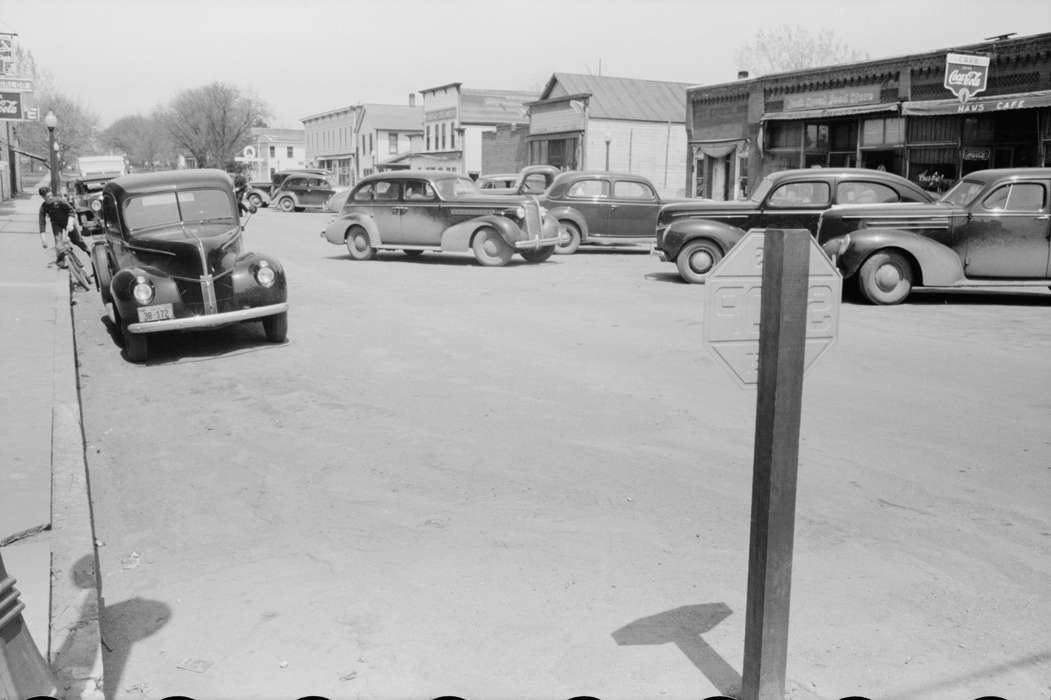 history of Iowa, street parking, Iowa History, Businesses and Factories, Motorized Vehicles, cars, Main Streets & Town Squares, Cities and Towns, Iowa, storefront, mainstreet, Library of Congress, dirt road