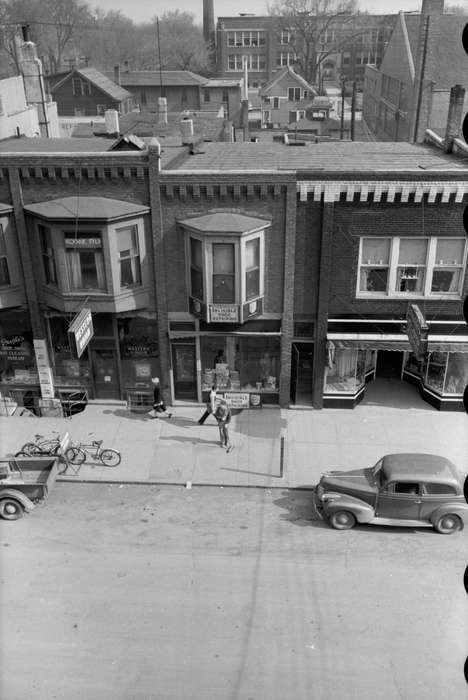 storefront, brick building, mainstreet, Library of Congress, Main Streets & Town Squares, Cities and Towns, Businesses and Factories, Iowa History, street parking, history of Iowa, roof, Iowa, Aerial Shots, bicycle