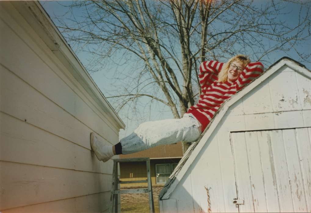 woman, goofy, Leisure, Pocahontas, IA, Clark, Paula, Iowa History, Portraits - Individual, Iowa, fall, laughing, shed, history of Iowa, outdoors, silly, laying, roof
