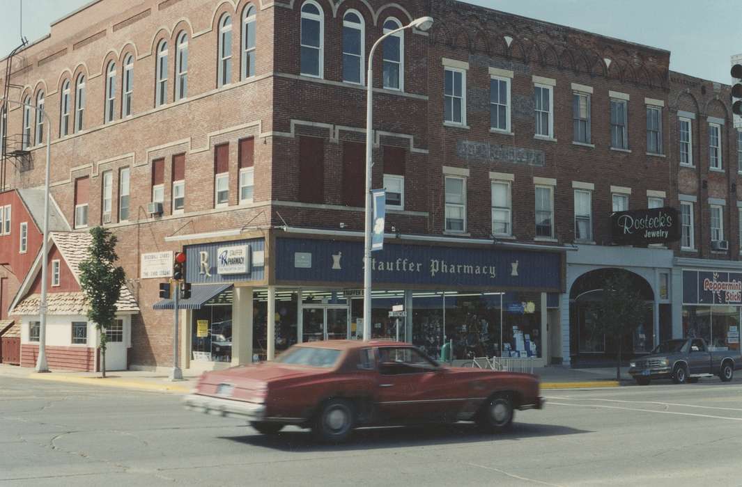 Businesses and Factories, pharmacy, storefront, jewelry store, mainstreet, Iowa History, brick building, Iowa, Waverly Public Library, Main Streets & Town Squares, Cities and Towns, history of Iowa, street corner, Motorized Vehicles