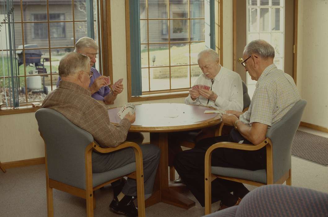 old people, table, window, outfit, elderly, men, Homes, Iowa History, card game, chairs, cards, Western Home Communities, glasses, Iowa, Leisure, history of Iowa