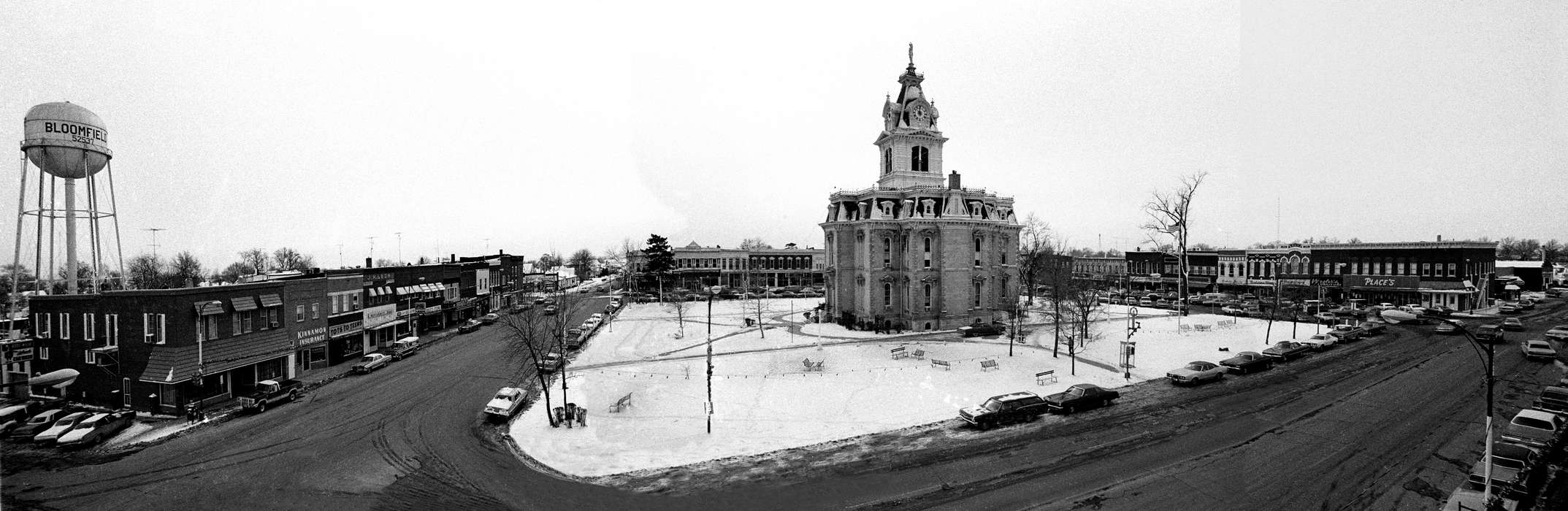 snow, storefront, christmas decorations, Winter, park, courthouse, town square, Cities and Towns, tower, Bloomfield, IA, history of Iowa, Motorized Vehicles, Businesses and Factories, Iowa History, car, water tower, park bench, Iowa, Lemberger, LeAnn, Main Streets & Town Squares, Aerial Shots, store, clock, Prisons and Criminal Justice
