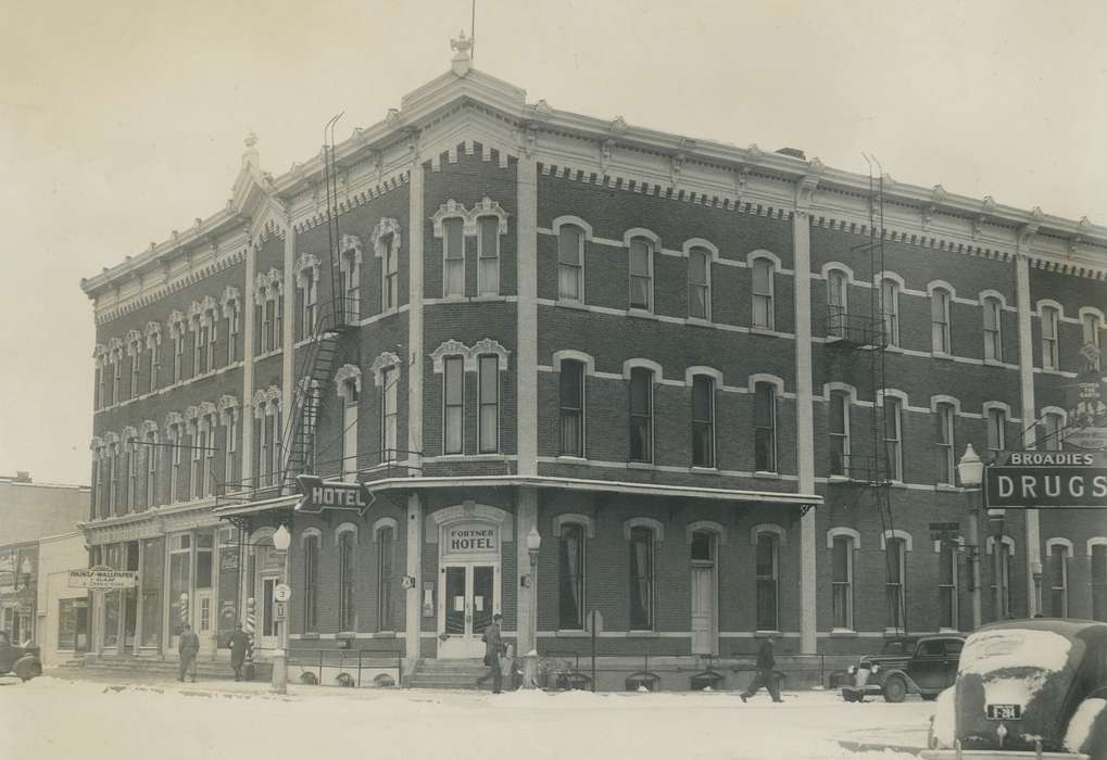 Waverly Public Library, Cities and Towns, Iowa History, hotel, drug store, cars, snow, Businesses and Factories, Waverly, IA, Main Streets & Town Squares, Motorized Vehicles, history of Iowa, Travel, correct date needed, Iowa, Winter, street corner