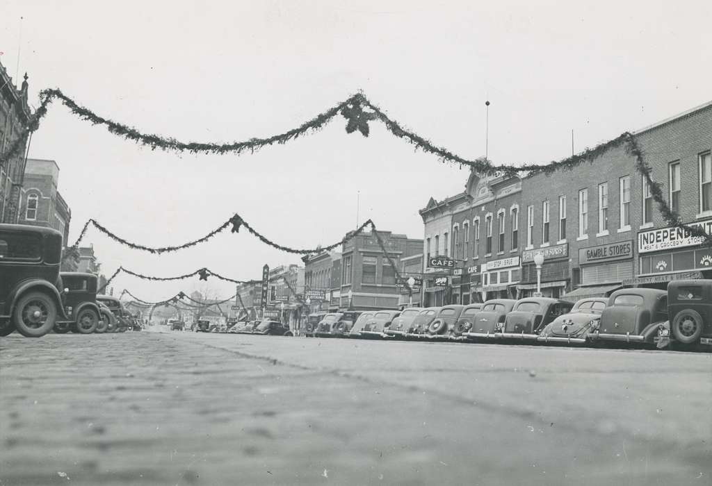 Holidays, christmas decorations, street parking, shops, Waverly, IA, Winter, correct date needed, celebration, cars, Cities and Towns, history of Iowa, Motorized Vehicles, parking, downtown, Businesses and Factories, Iowa History, snake eyes view, Iowa, Waverly Public Library, Main Streets & Town Squares