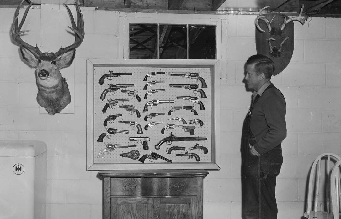 Portraits - Individual, United States, history, ia, Photos, guns, deer head mounted, Animals, antlers, Coon Rapids Enterprise, historic, Iowa, IA, Coon Rapids, display, Homes