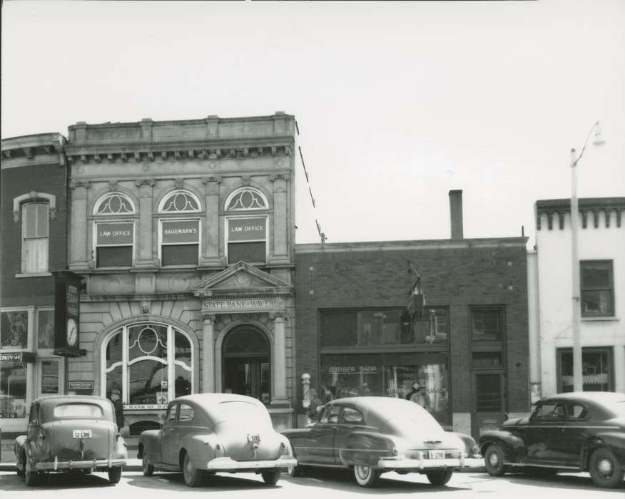 automobile, brick building, Waverly Public Library, street parking, Iowa History, barbershop, Waverly, IA, Main Streets & Town Squares, correct date needed, Iowa, history of Iowa, bank, Motorized Vehicles, Businesses and Factories