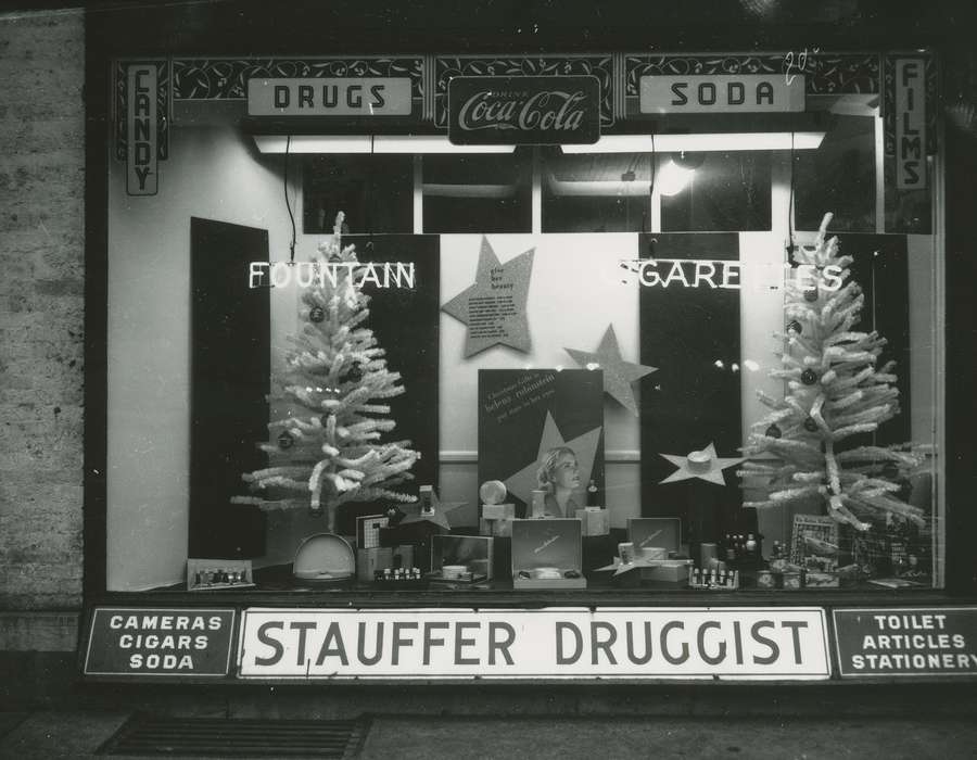 Waverly Public Library, Main Streets & Town Squares, Waverly, IA, window display, Iowa History, correct date needed, christmas tree, history of Iowa, Businesses and Factories, bottle, drugstore, Winter, Iowa