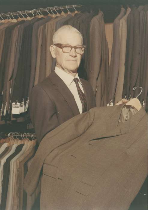 Labor and Occupations, Businesses and Factories, hangers, glasses, suit, Portraits - Individual, Coon Rapids Enterprise, Cities and Towns