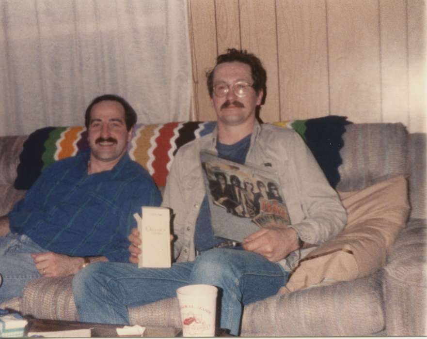 Nulty, Tom and Carol, glasses, Homes, couch, Iowa History, Iowa, Portraits - Group, Holidays, record, mustache, present, history of Iowa, vinyl, Des Moines, IA