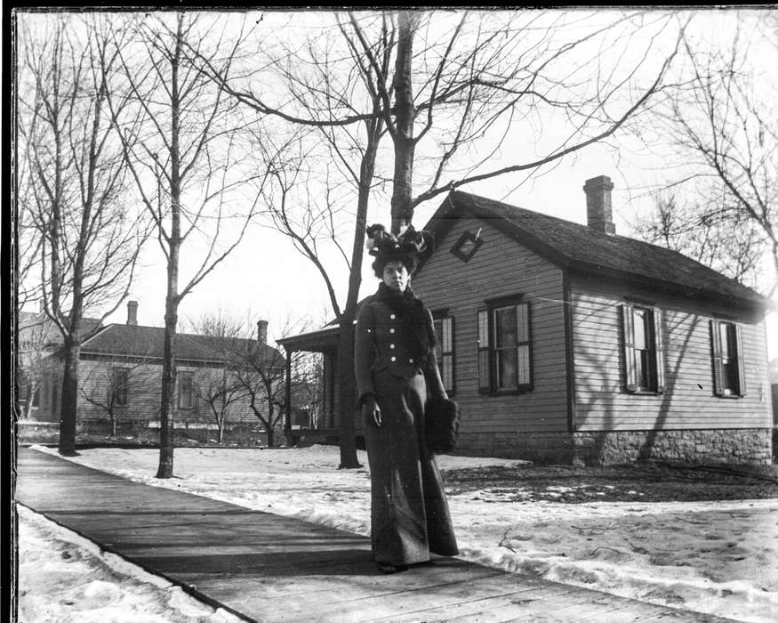 Iowa History, history of Iowa, sidewalk, Anamosa Library & Learning Center, Iowa, IA, coat, house, Winter, snow