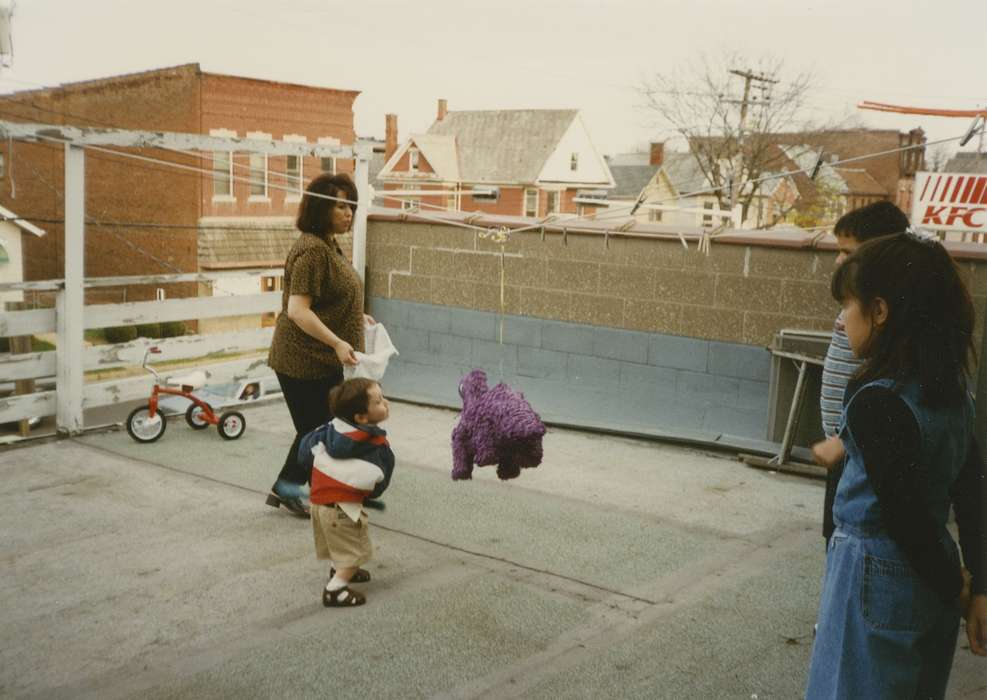 pinata, Iowa, Children, Dubuque, IA, Holidays, history of Iowa, Iowa History, Cities and Towns, People of Color, Valenti, Providence, Families, tricycle