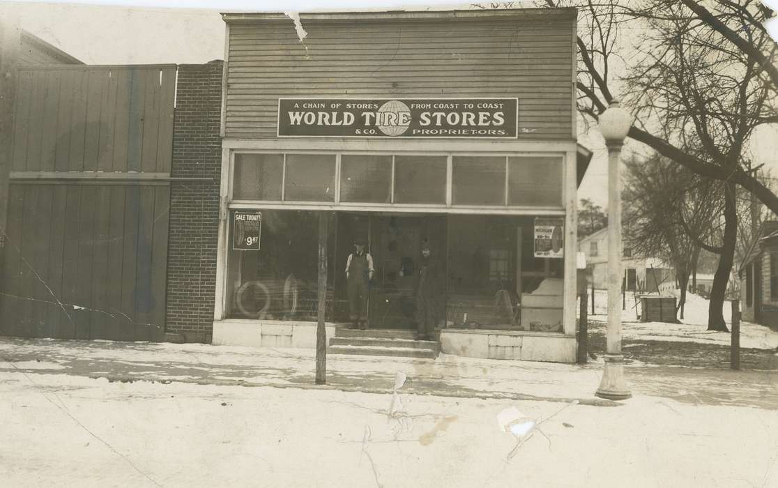 Businesses and Factories, storefront, Iowa History, tire store, lamp post, wooden house, Portraits - Group, Waverly, IA, Iowa, Waverly Public Library, businessman, Cities and Towns, store, history of Iowa
