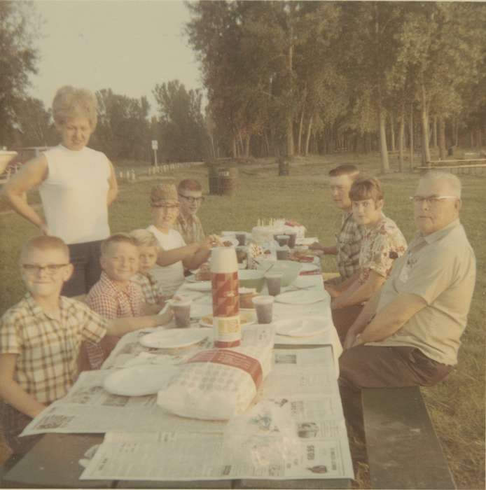 glasses, hairstyle, Children, IA, Iowa History, Henderson, Dan, Leisure, Families, park, picnic table, Food and Meals, Iowa, picnic, newspaper, history of Iowa, grandparents, table cloth