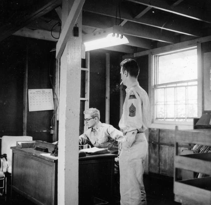 Labor and Occupations, Ely, IA, uniform, desk, calendar, Iowa History, cigarette, Iowa, history of Iowa, Portraits - Individual, Karns, Mike, Businesses and Factories, smoking