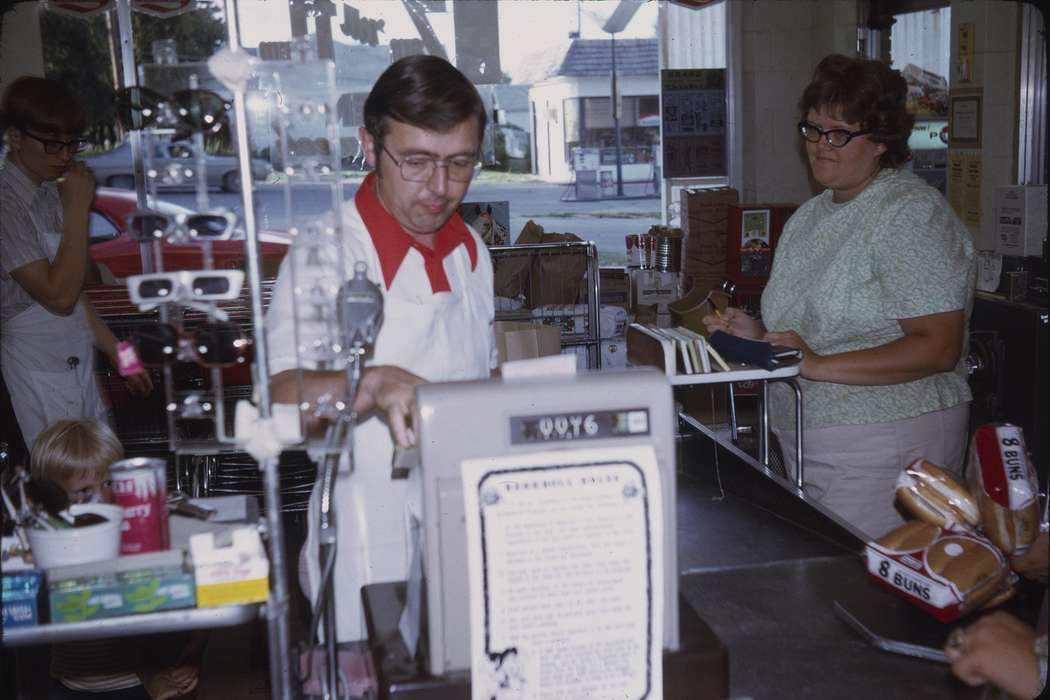 Businesses and Factories, Adair, Families, history, check out, cashier, Photos, Labor and Occupations, Children, cash register, Iowa, sunglasses, children, IA, Cities and Towns, Greenfield, Motorized Vehicles, check, soda pop, gumball machine, soda, United States, bubble gum, ia, grocery store, business, food, supermarket, historic, gas pump, supervalu, Comstock, Sara